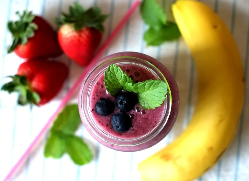Strawberry Blueberry Smoothie Prep time: 5 mins Cook time: 10 mins Total time: 15 mins Serves: 2 Ingredients: · 1/4 cup of Blueberries · 5-6 large/8-9 medium Stawberries (green crown on top removed) · 1 large Banana · 1/4 cup Water/Lemon-infused Water/Coconut Water · 5-6 Mint leaves · 1/2 cup Chia Seeds · 1 tablespoon Apple Cider Vinegar · 5-6 Ice cubes Instructions: 1) Wash the blueberries and strawberries beforehand. 2) Pour the water into the blender, followed by the banana (broken into a few pieces), and the berries, turn blender on to whizz. 3) When all the fruits are broken down, add the chia seeds and apple cider vinegar, blend further. 4) Lastly, throw in the ice cubes one at a time and whizz for a while longer. 5) Before serving, steep the mint leaves in the smoothie for at least 5 minutes in the fridge.