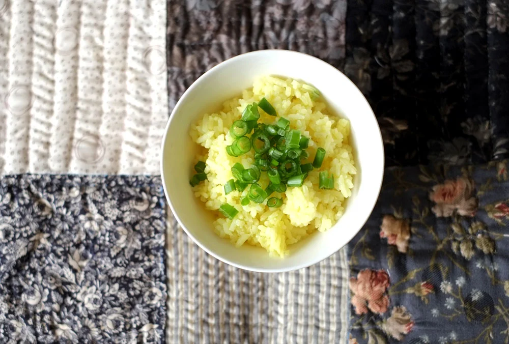 Garlic Butter Rice Prep time: 5 mins Cook time: 30 mins Total time: 35 mins Serves: 4-5 Ingredients: · 2 cups of uncooked rice · 5-6 cloves of minced Garlic · 2 tablespoons unsalted Butter · 1 teaspoon Salt · 1/2 teaspoon Turmeric Instructions: 1) Wash your rice in a rice cooker pot and throw in the minced garlic, unsalted butter, turmeric and salt. 2) Mix evenly and cook with the amount of water as indicated in your rice cooker or 1-3/4 cups of water to 1 cup of rice. 3) When the rice is cooked, use a large spoon and toss the freshly cooked rice around (take in the fluffiness!), and season further if necessary (another half teaspoon of salt, tops!).