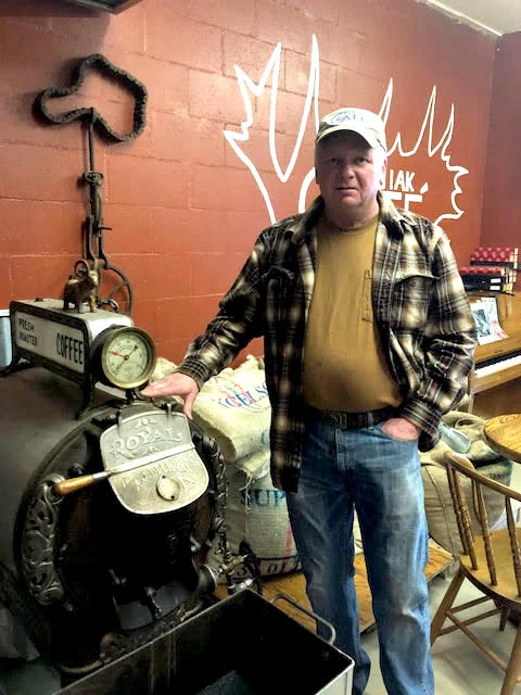Chugiak Cafe owner, Trig Bjorklund, with his 1910 coffee roaster