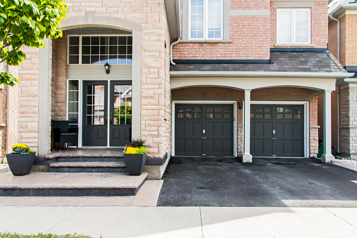 3346 Moses Way - Close up of front door & two door garage