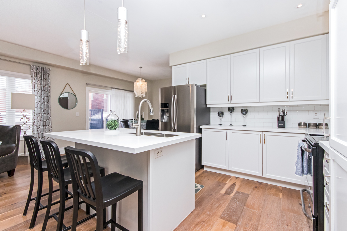 3346 Moses Way - Alternative angle of the kitchen island with bar stools