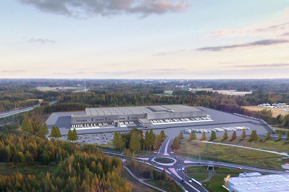 Lidlin uusi jakelukeskus havainnollistettuna sellaisena kuin se tällä hetkellä paikallaan seisoo. Liikenneympyrän takana olevan pienen metsäpläntin takaa alkoi pelto, jonka takana, rakennuksen vasemmalla puoliskolla seisoi itse kallio. Moottoritie takavasemmalla. Kuva: https://www.lidl.fi/fi/Jarvenpaan-jakelukeskus-3312.htm
