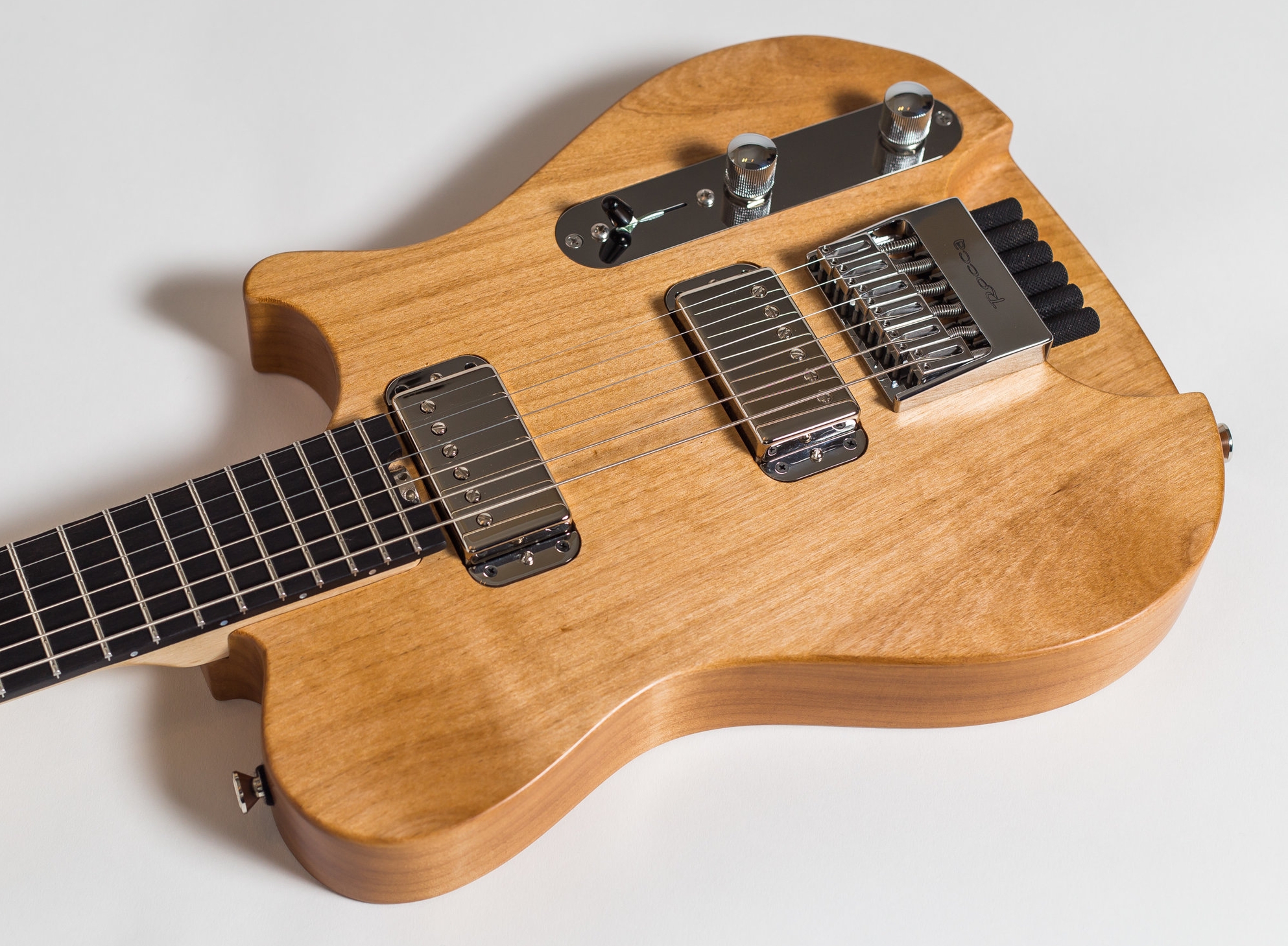 A dual acting truss-rod is installed, having easy access to adjustment at the end of the fret-board. Fretboard edges are rolled off to improve ergonomics. Both, the guitar neck and body are finished by hand using Tru-Oil, as it lets the woods to vibrate more freely and age more naturally. Also, it provides a smoother, more organic feel when playing the guitar.
