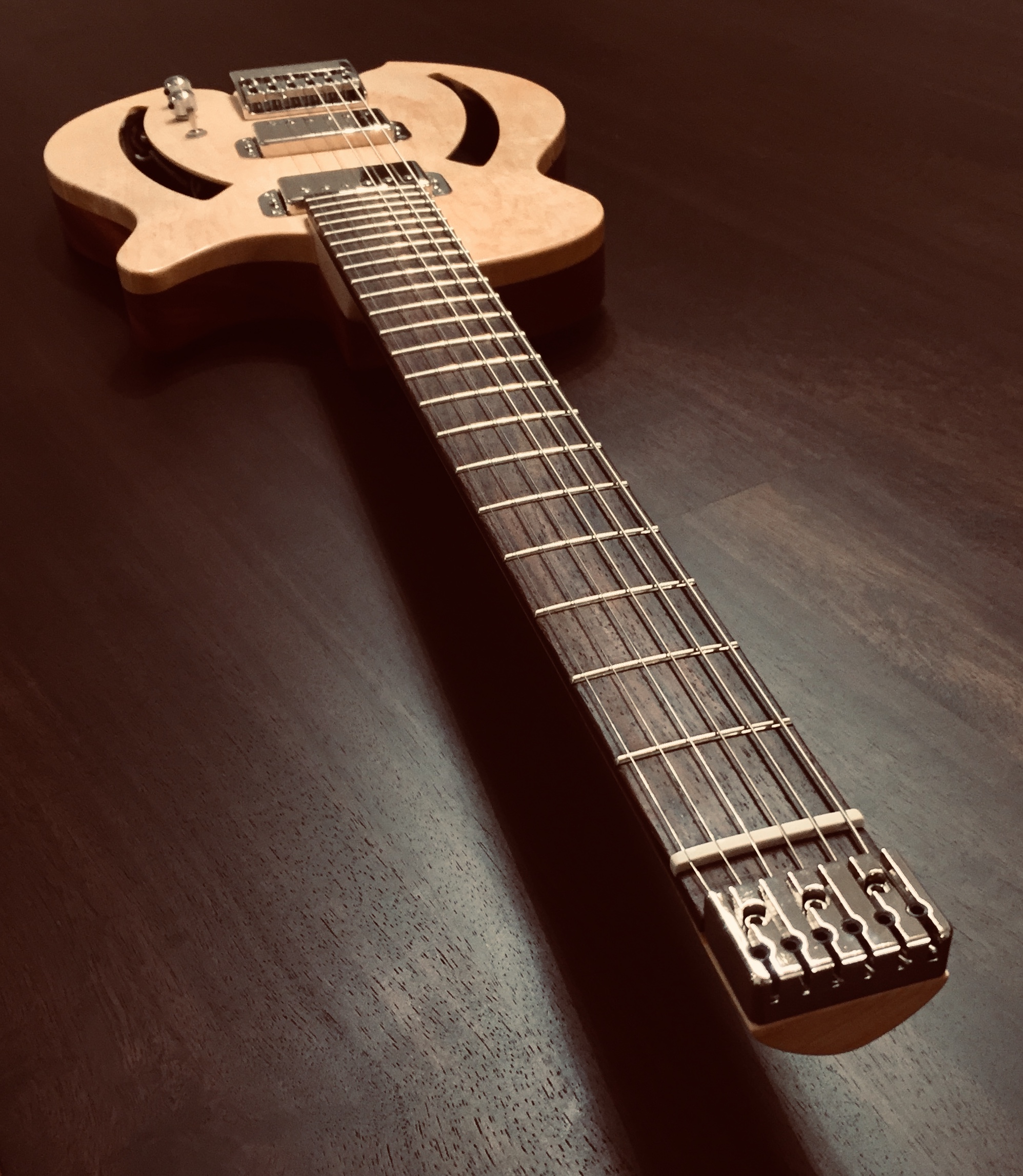 The fretboard is made of Pao Ferro and its radius is compound (10” to 16”). A dual acting truss-rod is installed, having easy access to adjustment at the end of the fretboard. Twenty-Two, size 6105 Stainless-steel frets are set in order to assure smooth playing and reduced maintenance. Fretboard edges are rolled off to improve ergonomics. Hand-Cut mother of pearl inlays are selected to define the fretting positions. The guitar’s scale length is 24.75”, propelling a beautiful, buttery tone and making bending more fluid. American quarter-sawn maple for the neck shaft to provide maximum stability thus enhancing the instruments resonance. The neck is shaped in a ‘Smooth V transitioning to C’ fashion in order to assure ergonomics.