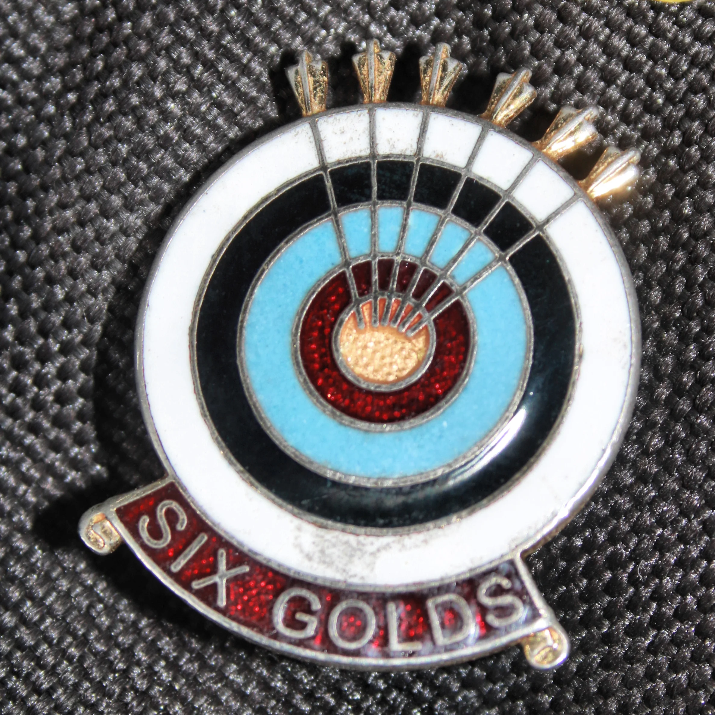 6 gold end badge.jpg