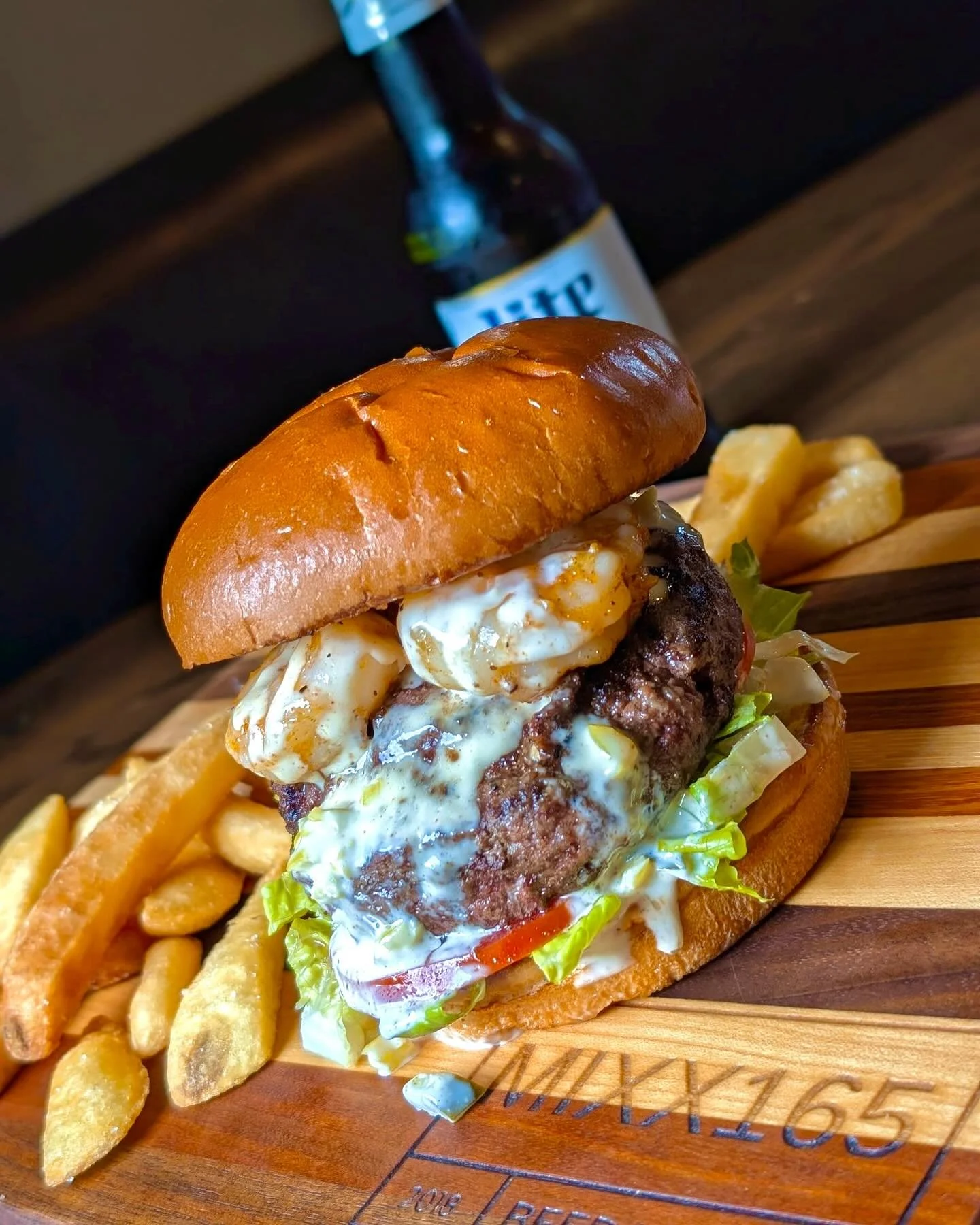 Surf and turf burger with shrimp and banana pepper tartar at MIXX165 near Urbana