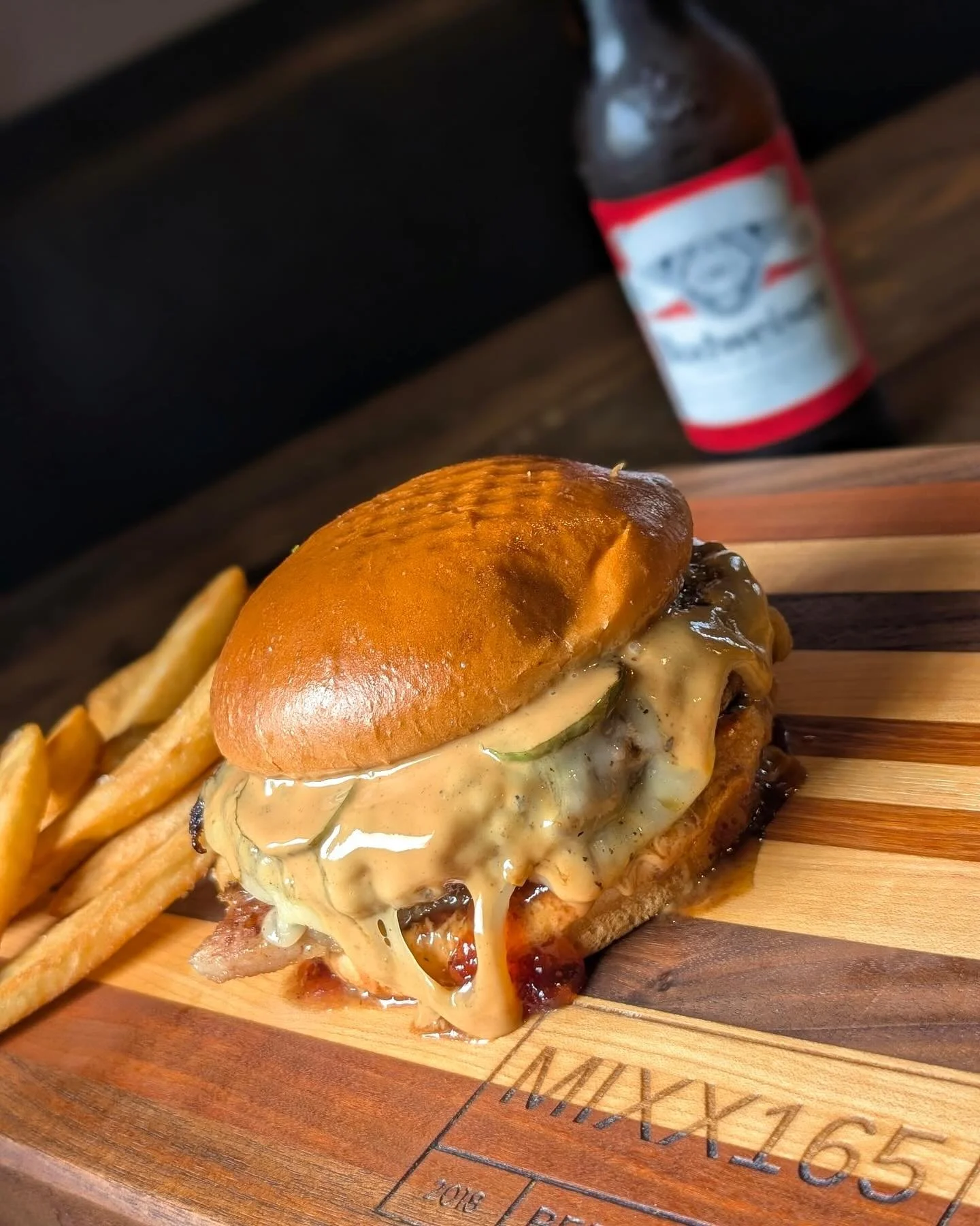 Creative burger topped with peanut butter, jelly, and jalapeños served near Urbana