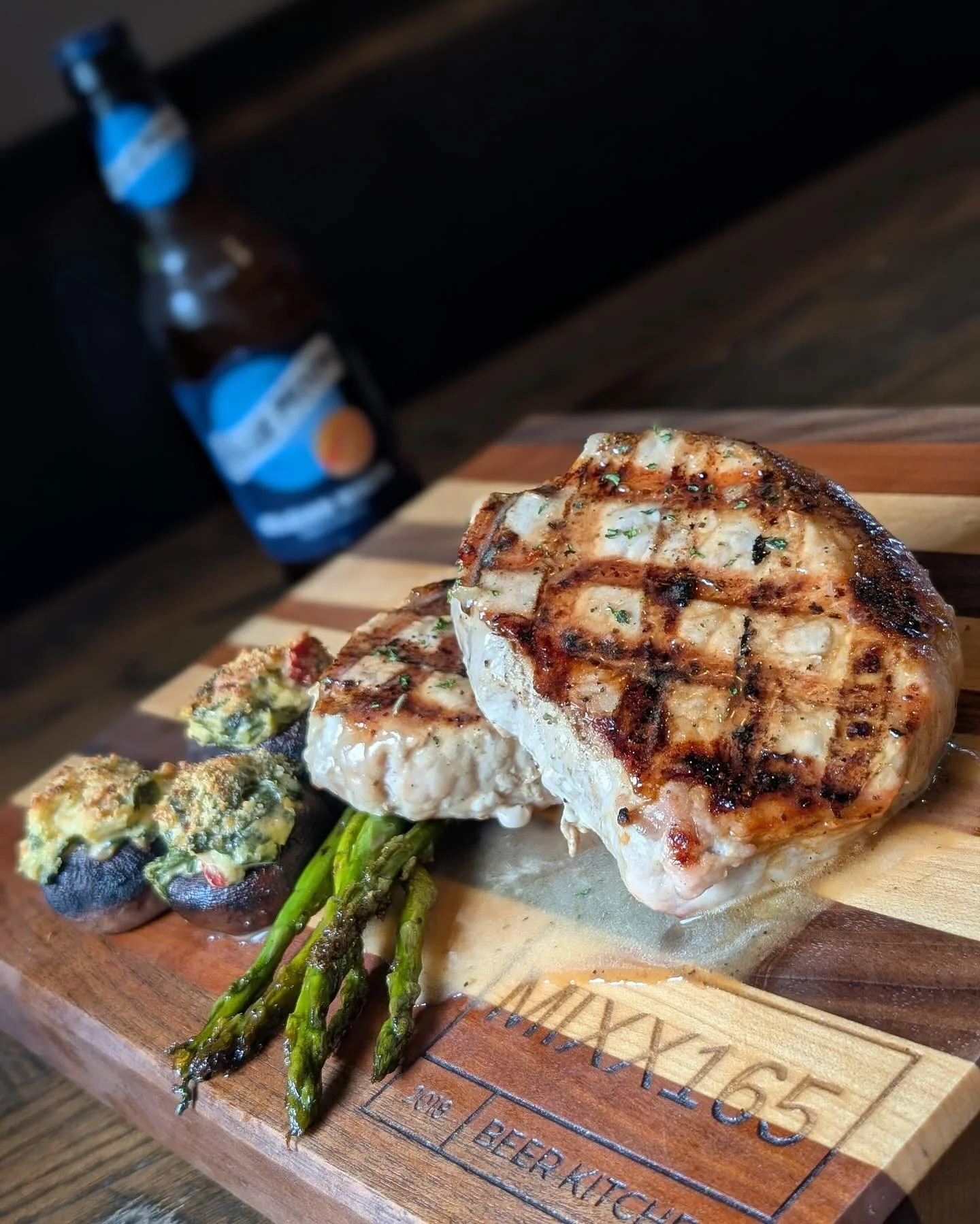 Honey garlic pork chops with asparagus and stuffed mushrooms at MIXX165 near Urbana