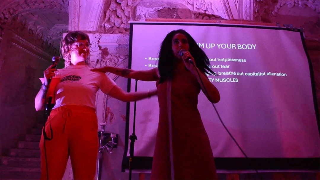 Catie and Yuval with Warm Up Your Body Slide.jpg