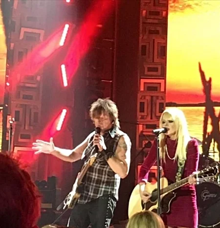 Richie Sambora performs in one of his many V&G guitar straps while wearing his V&G leather cuff.