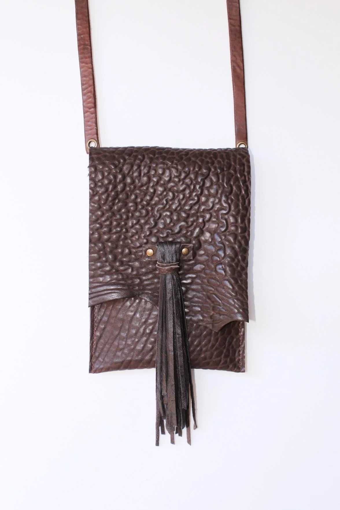 Textured brown cowhide bag with long soft lambskin tassel. $128..jpg