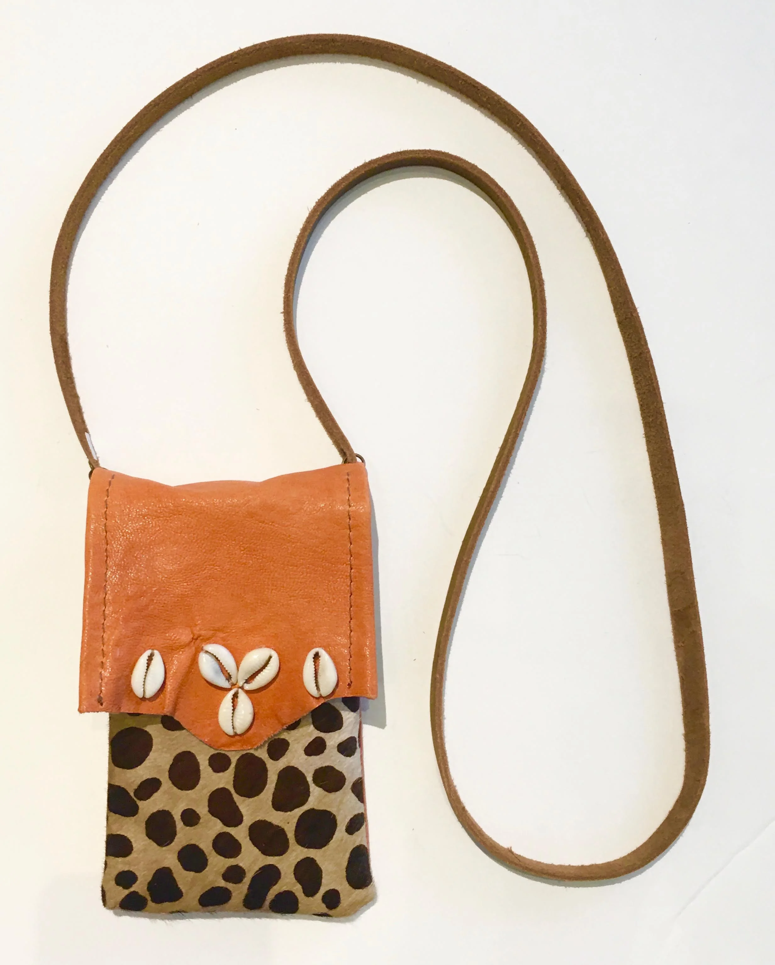 Hair on hide cross body bag with coral lambskin flap embellished with seashells. $128..jpg