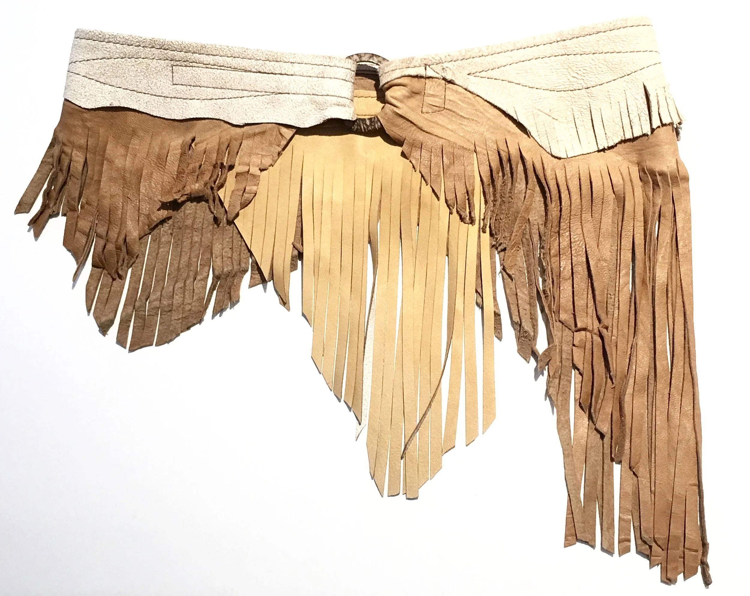 Antique beige crackle and tan leather with layered fringe. Coconut shell and adjustable velcro closure. $348. .jpg