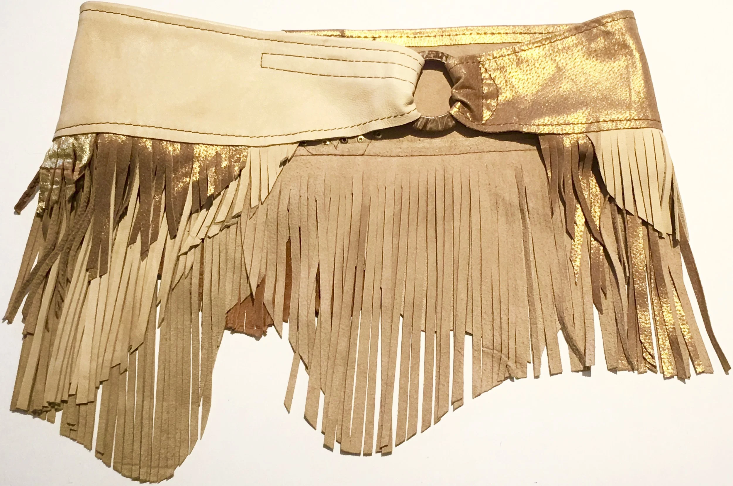Light tan and metallic gold lambskin. Layered fringe and gold colored stud work. Coconut ring with adjustable velcro closure. $380.jpg