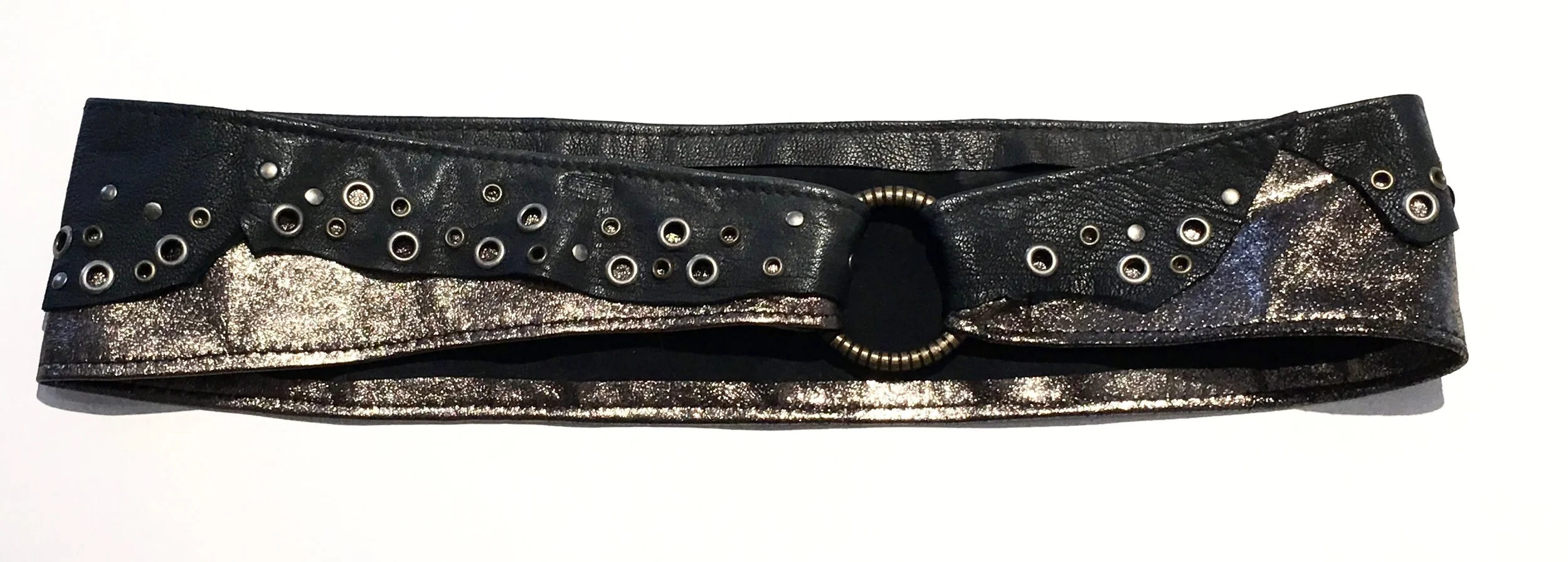 Black and bronze metallic lambskin with antiques brass and nickel metal work. Brass ring with adjustable velcro closure. $298..jpg