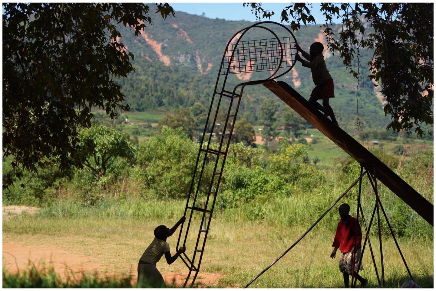 Girls play on a slider at a sports club in Ngangu township, Chimanimani, Manicaland Province, Zimbabwe.

More than a year on after the devastation of the area by cyclone Idai hundreds of people are still missing while others are homeless living in sq