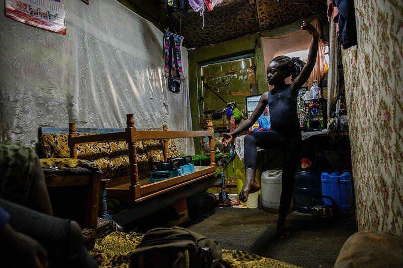 Valentine Ayuma, a 10-year-old ballet dancer, follows a Facebook Live stream at home. The dance session was organized by Mike Wamaya, founder of the nonprofit Project Elimu. Due to lockdowns when the pandemic began, students in Kenya were trained via