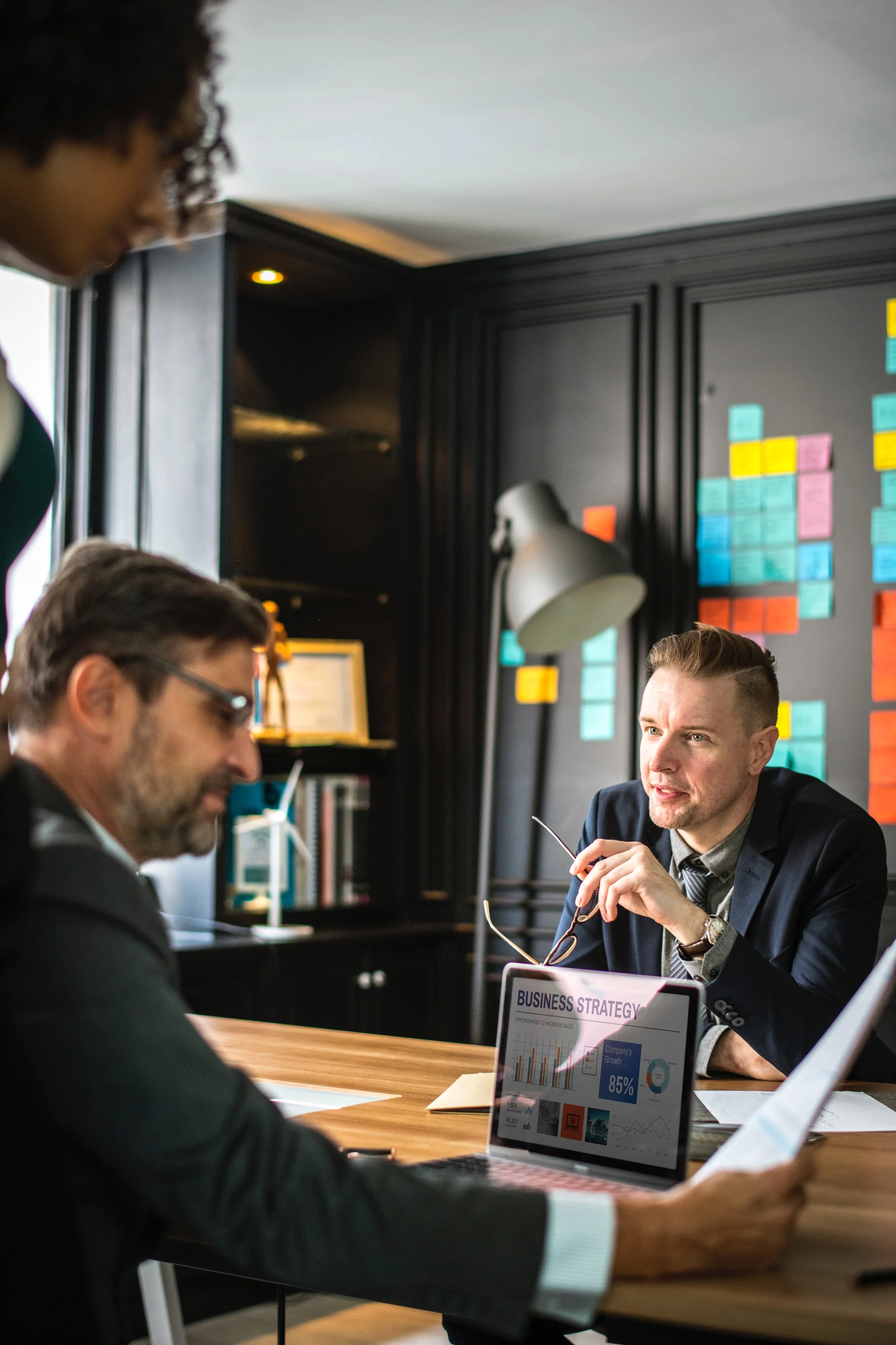 Two male colleagues in a meeting discussing business strategy