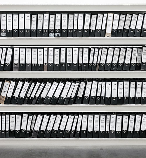 four rows of files stored on shelf