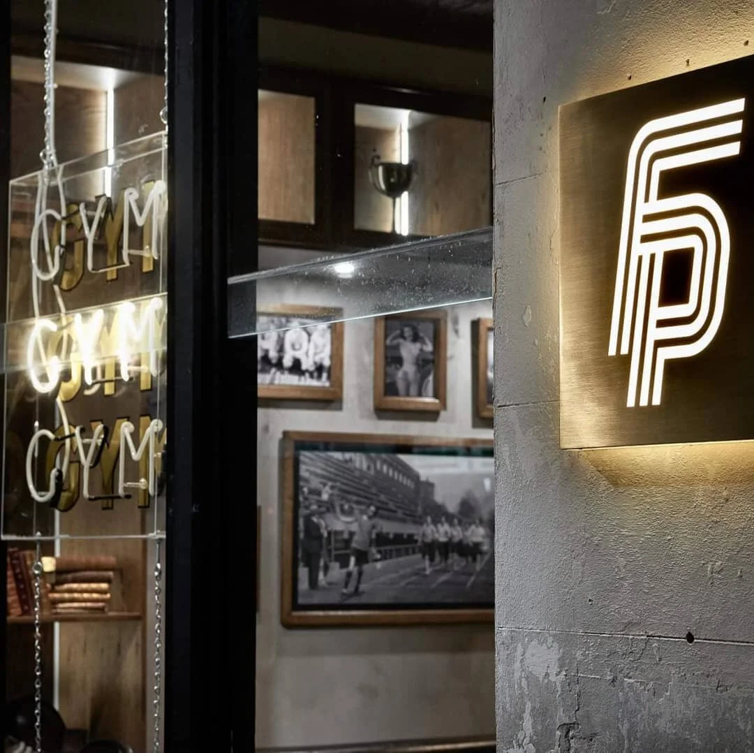 External brushed gold illuminated plaque sign and neon for @fitnessplaygroundaus