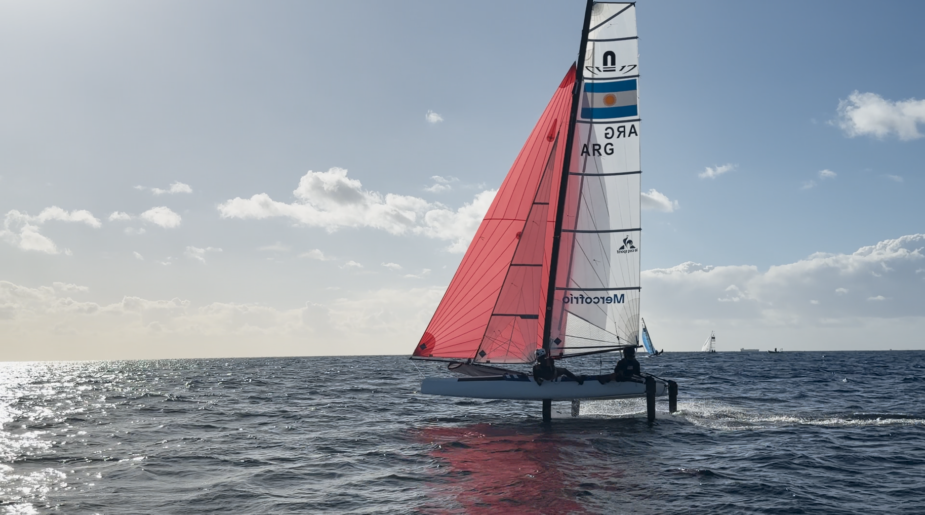 Aidan Mobley racing on a Nacra 17 high performance catamaran that foils