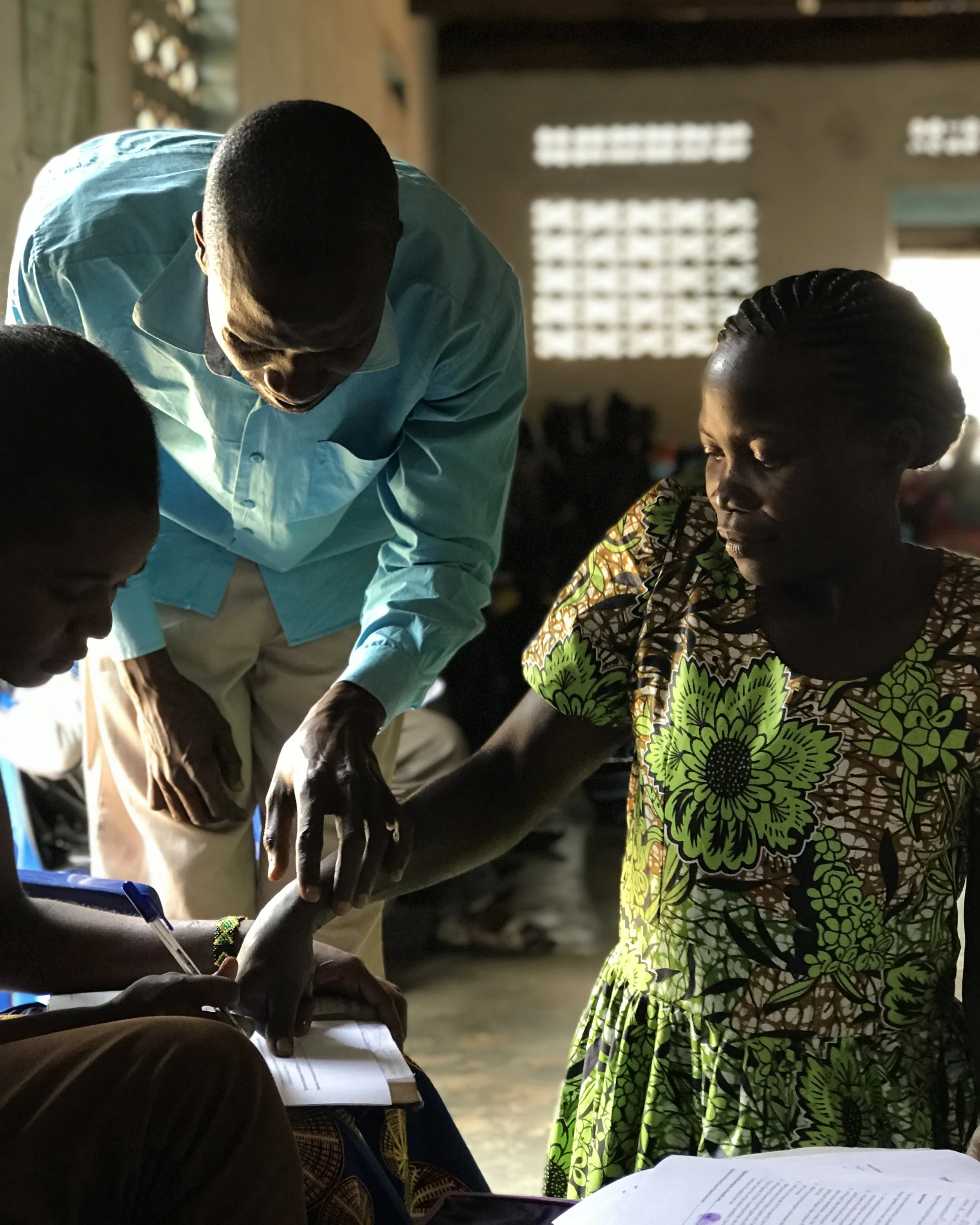 A Ugandan woman officially becoming a part of The Goat Project.