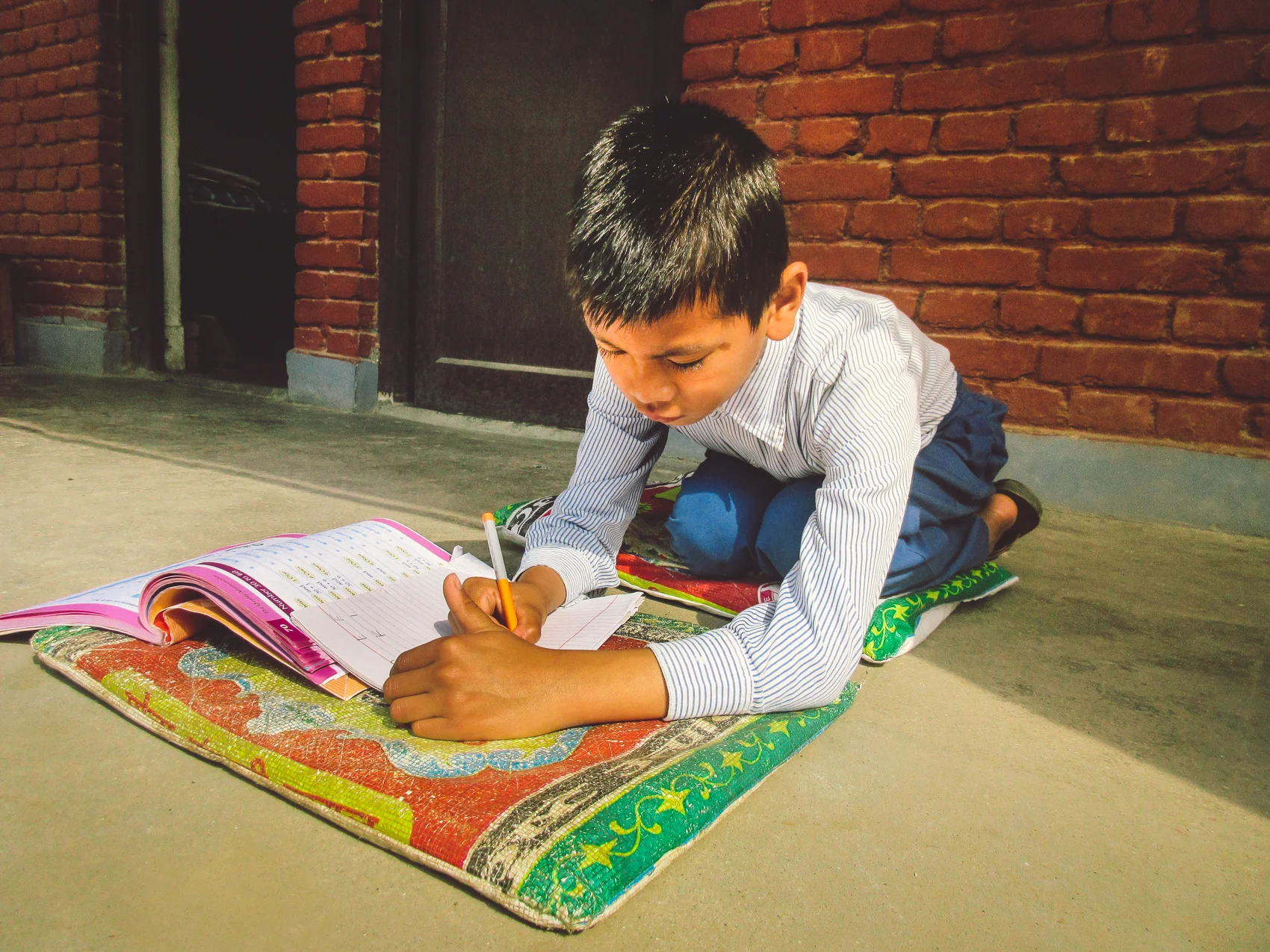 One of the students enjoying studying out in the sunshine. 