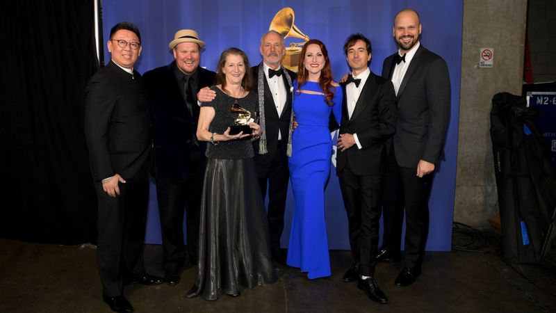 The team behind opera recording winner "The (R)evolution of Steve Jobs," including composer Mason Bates, second from right, and Edward Parks, who played Jobs, far right, pose backstage at the Grammy Awards' pre-telecast ceremony Sunday at Microsoft Theater in L.A. (Emma McIntyre / Getty)