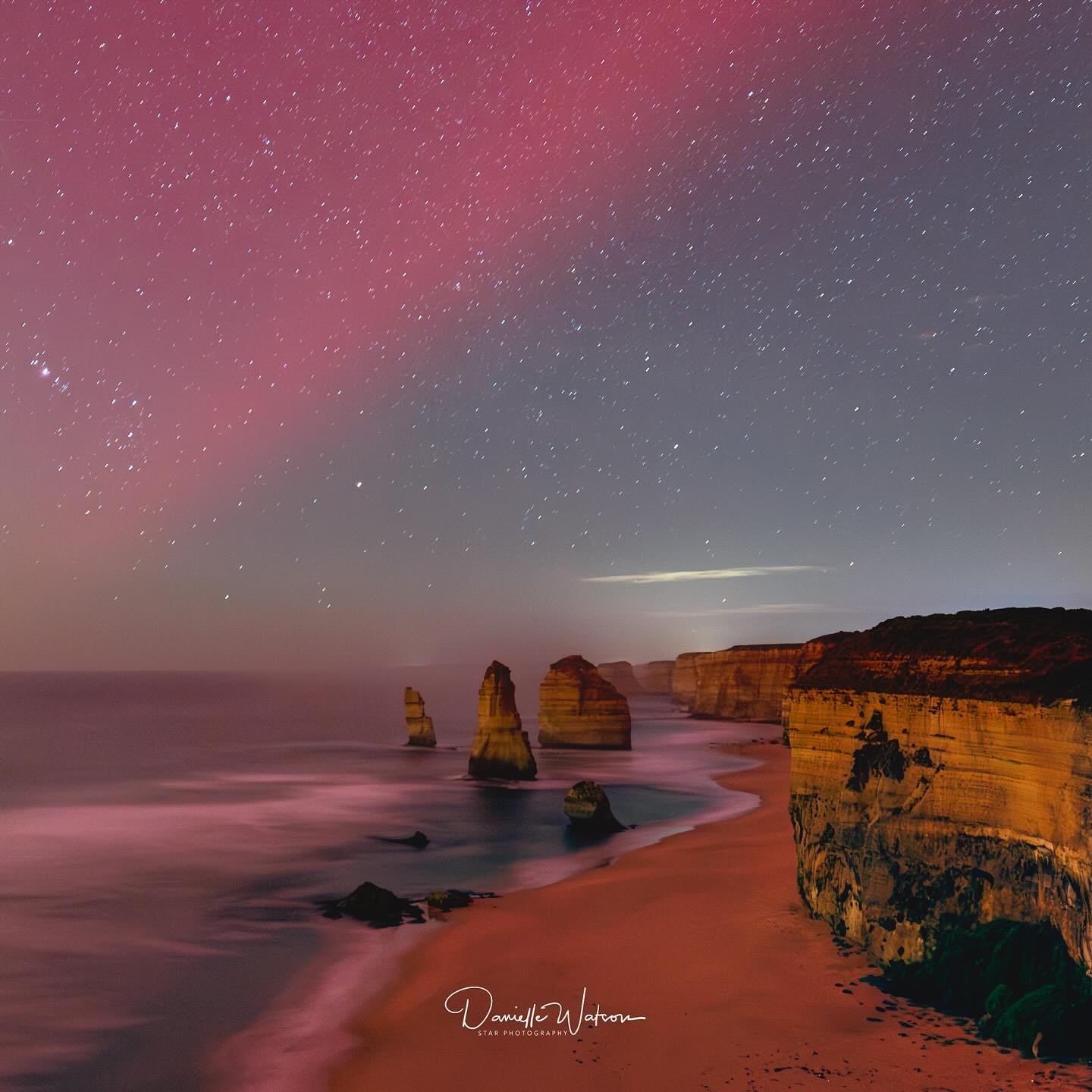 Under the celestial ballet of the most vivid aurora storm in 22 years, I stood at the precipice of natural wonder, the Twelve Apostles. It was a night where the skies seemed to unravel their mysteries, painting the sky in strokes of green, purple, an