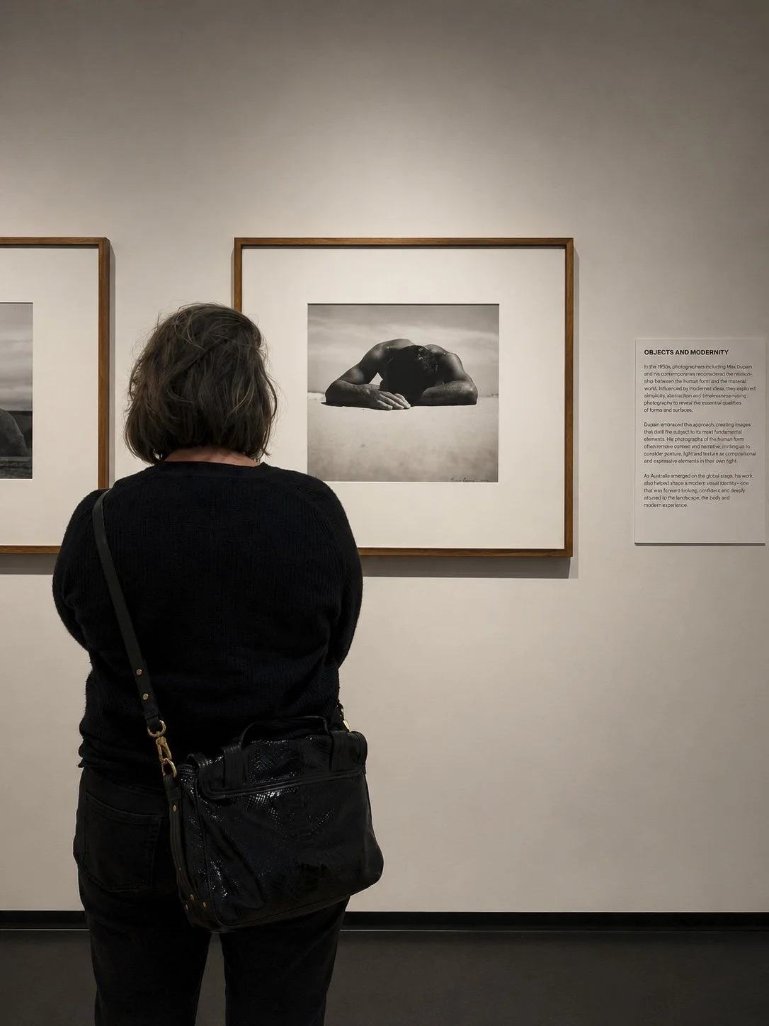 Visitor viewing Max Dupain's Sunbaker at Bayside Gallery