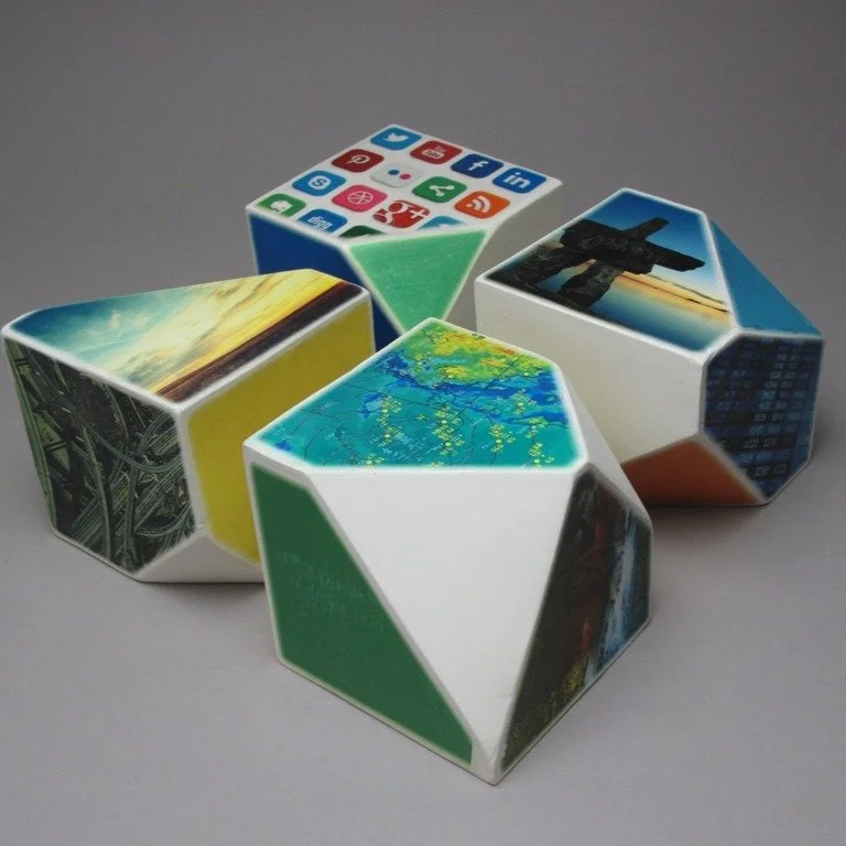 Name: Heidi McKenzie

Title: Facets (set 1)

Materials: slipcast porcelain, ceramic decals

Dimensions: each faceted cube 4.5&quot; x 4.5&quot; x 4.5&quot;, installation variable

Retail price: $750.00CDN

Starting bid: $325.00CDN

Bidding ends 12/7/