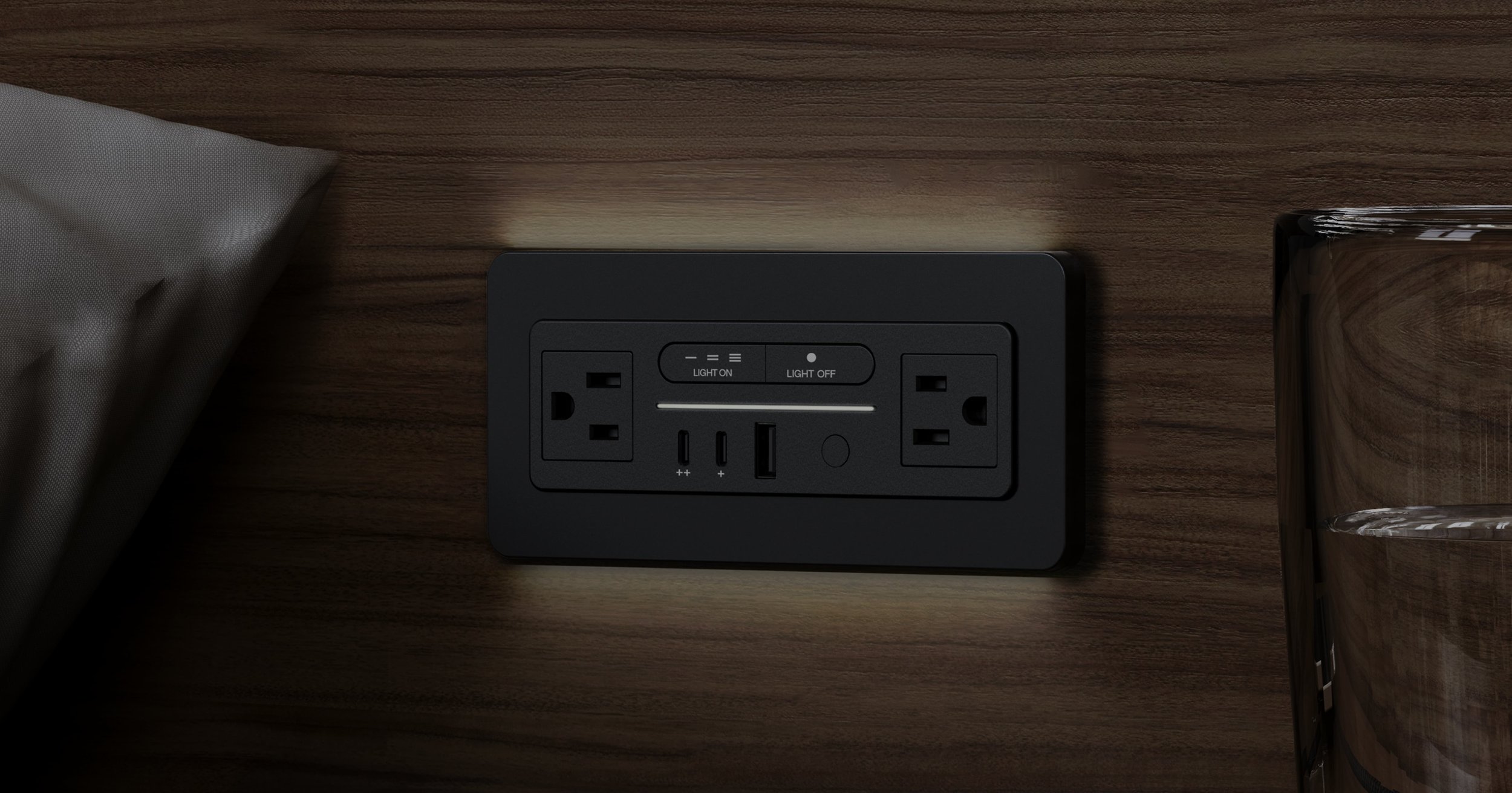 Nonstop Terminal 1 built-in hotel power outlet with GlowWell architectural lighting on a guestroom nightstand
