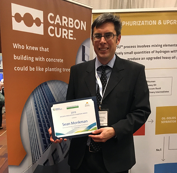 Dr. Sean Monkman with his Mission Innovation Champion award at the awards ceremony in Vancouver.