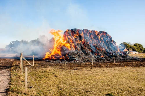 The hay stack still ablaze.