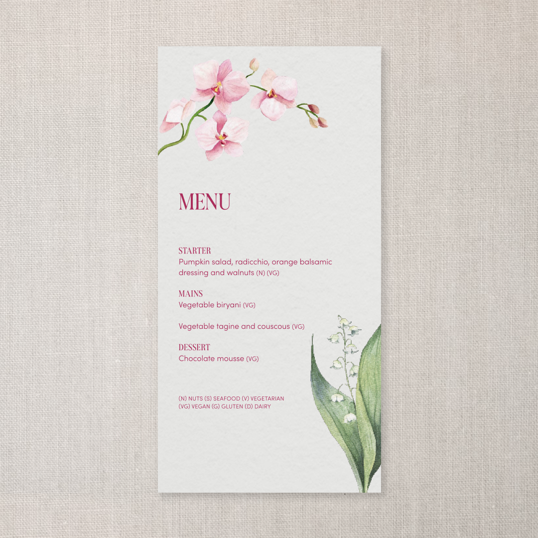 A delicate menu with a pink orchid flower at the top left and a lily of the valley at the bottom right. The menu is divided into sections for starter, mains, and dessert, with additional dietary symbols at the bottom.