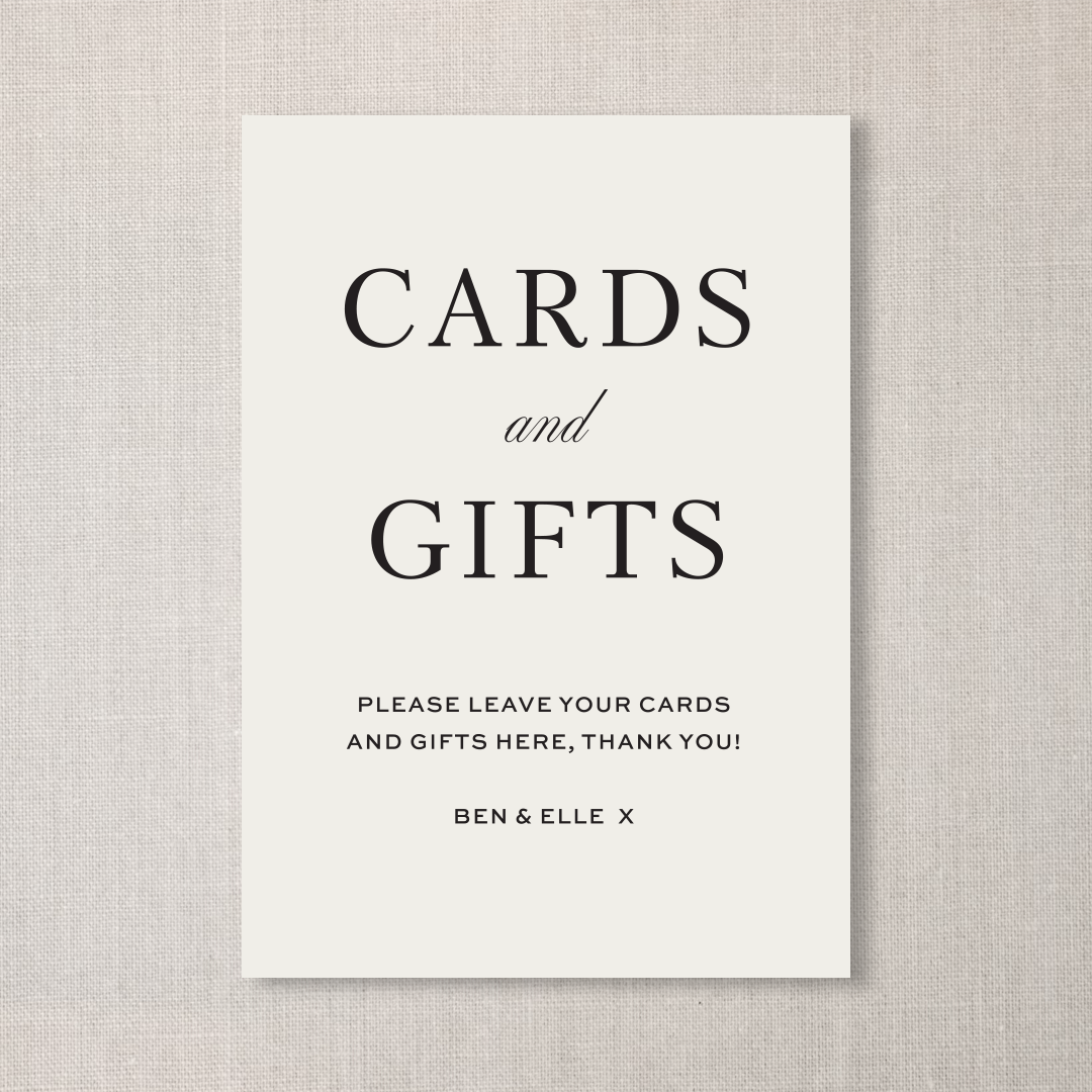 Sign on a beige background that reads "Cards and Gifts" with a note to leave cards and gifts there, signed by Ben & Elle.