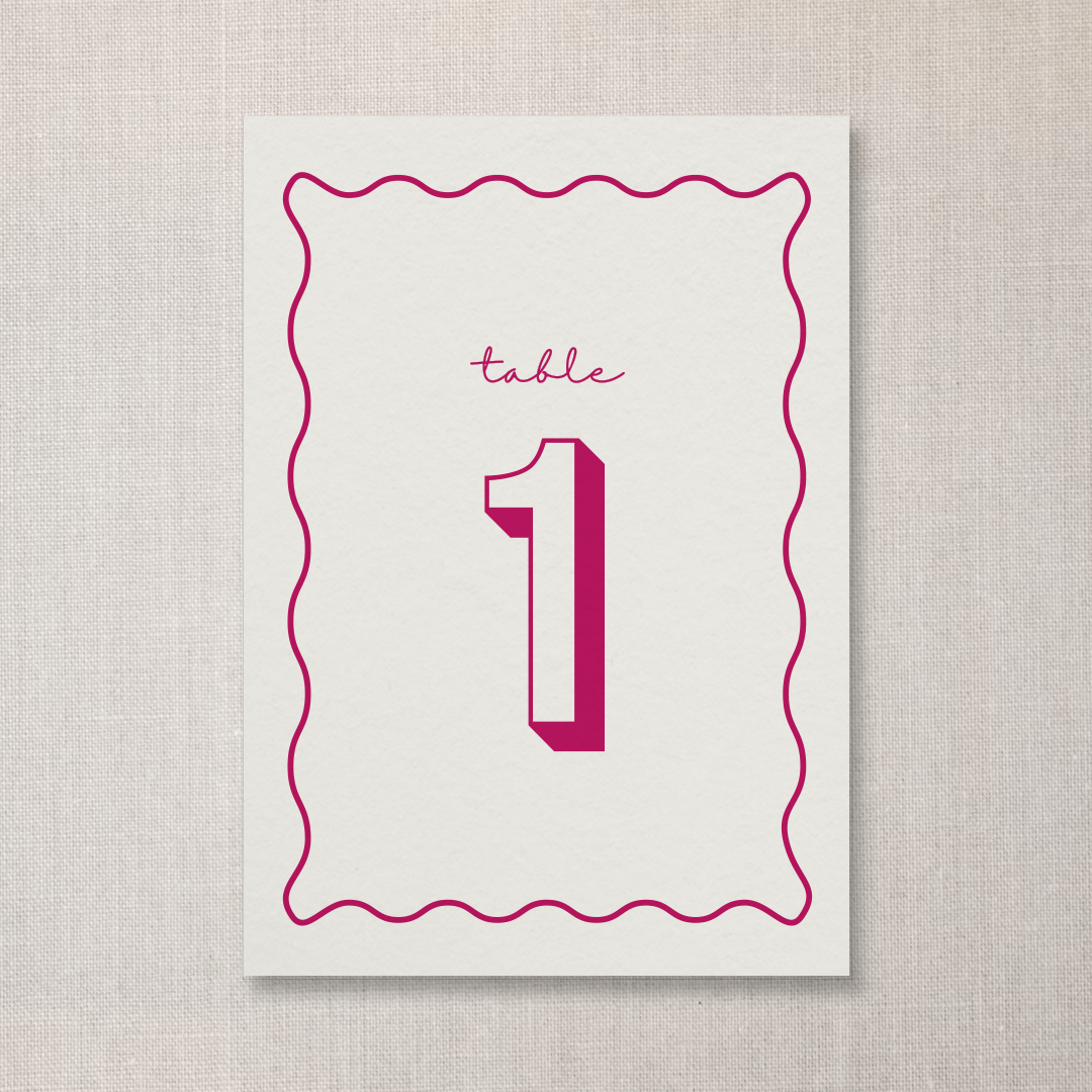 Place card with a pink wavy border, the word 'table' written in cursive, and the number '1' in large pink font.