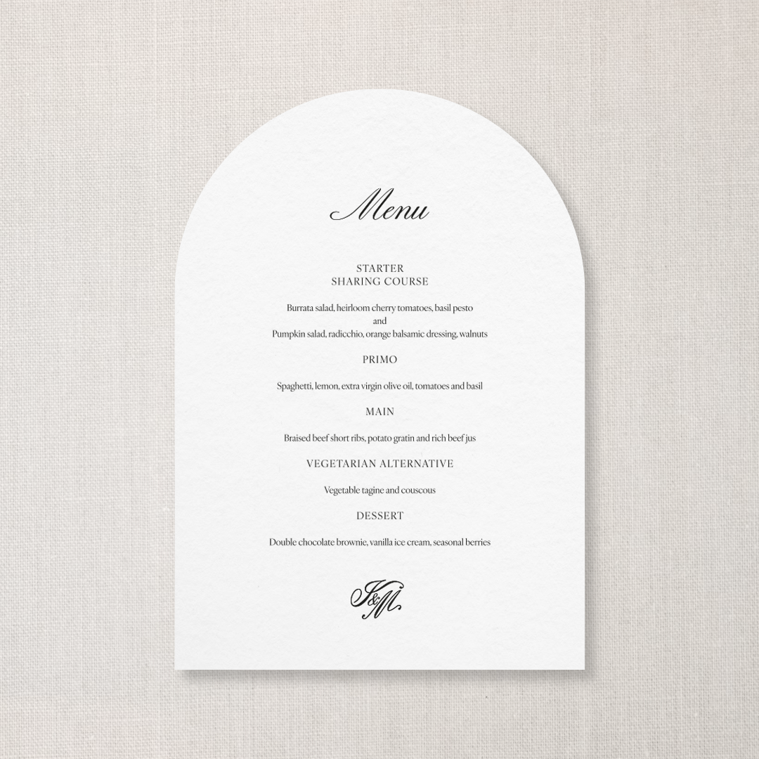 Elegant restaurant menu with courses listed, including starter, primo, main, vegetarian alternative, and dessert, on a white arched paper against a textured beige background.