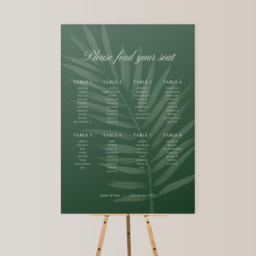 A green seating chart with leaf print background, titled 'Please find your seat,' listing names for 8 tables, and a note with names 'Natalie & Liam' and the date '17th October 2025' at the bottom.