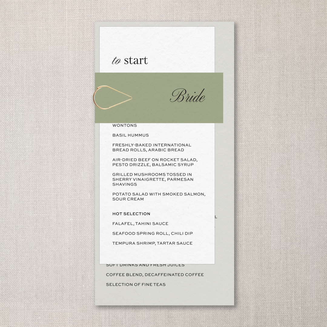 A wedding menu with a green band and gold paperclip, featuring starter options.