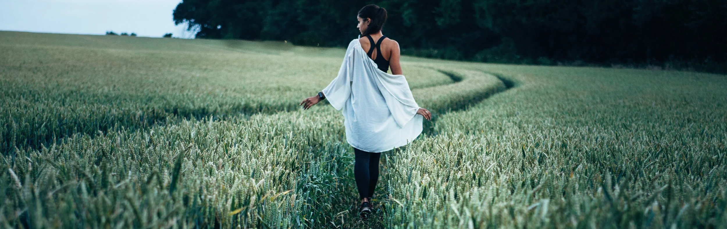girl in field on path.jpg