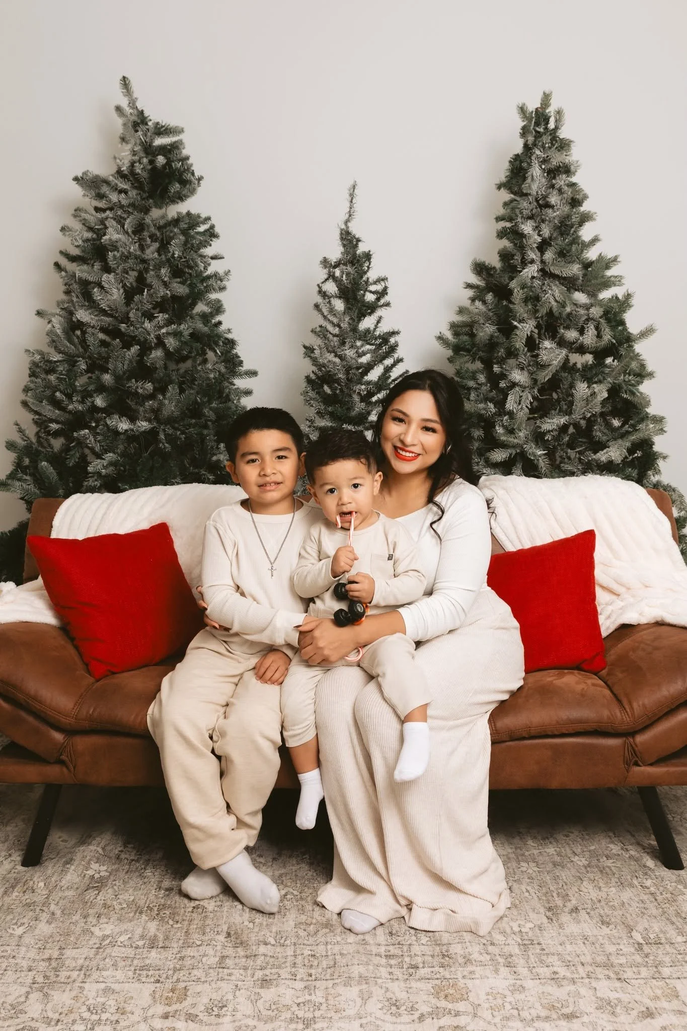 christmas family mom two children infant tree couch