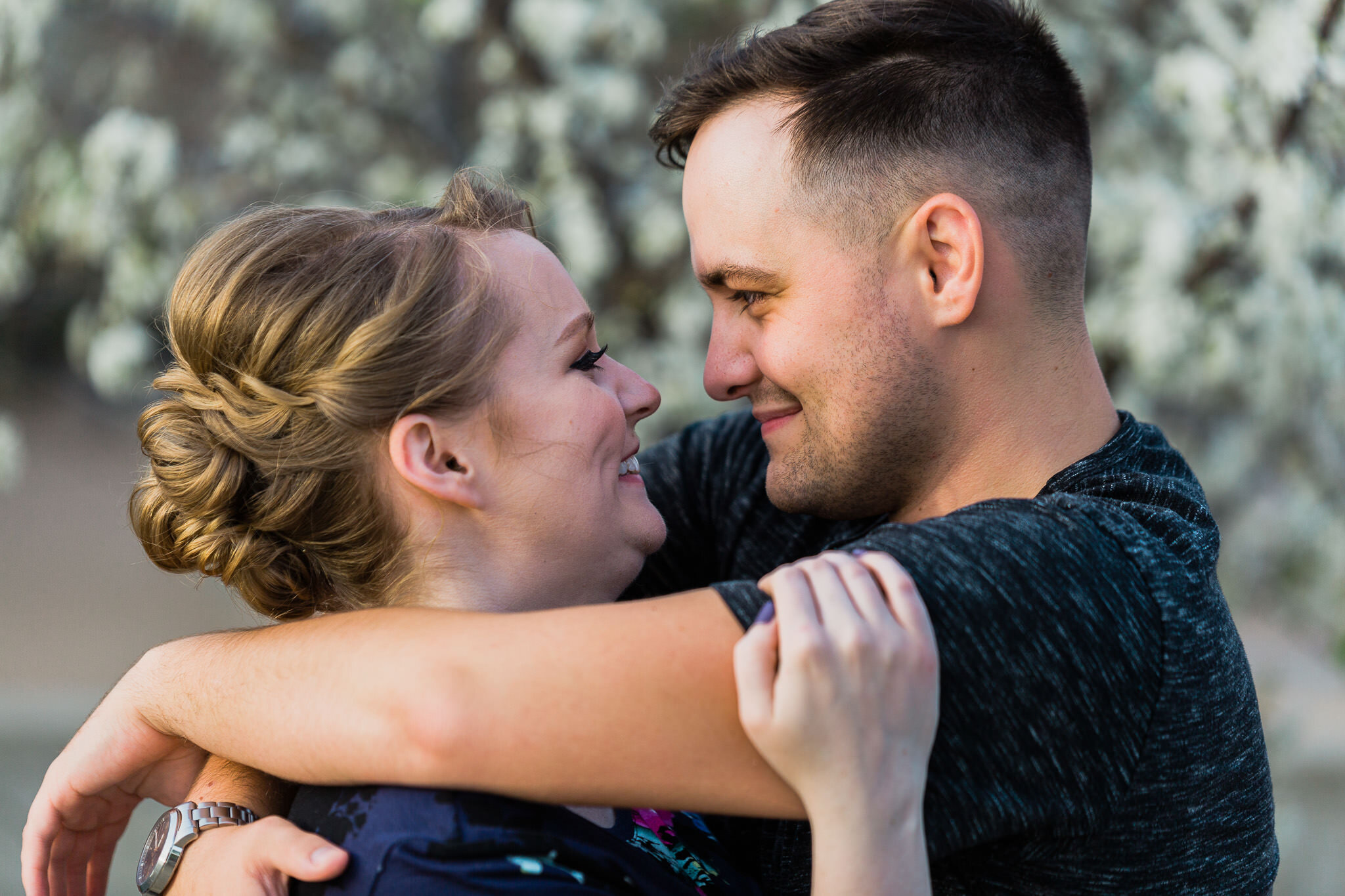 Couple near kiss with blooms