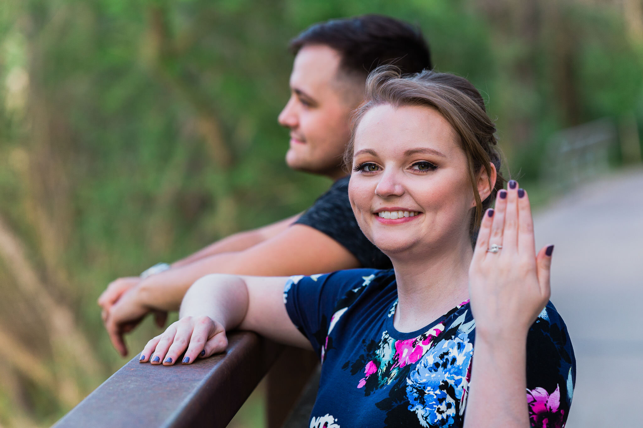 couple woman showing engagement ring