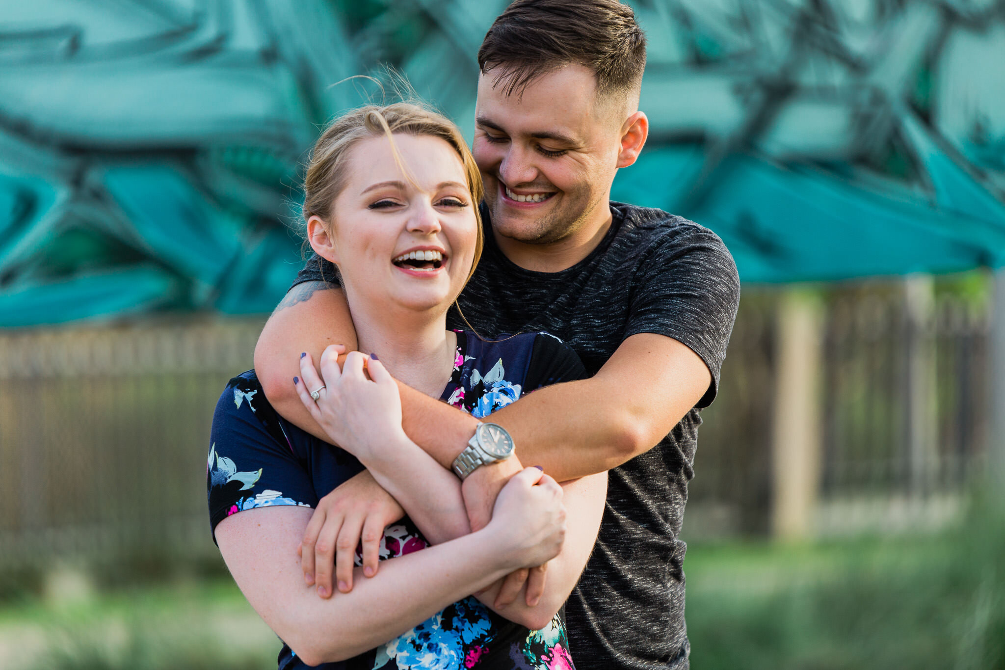 couple candid laughing pose