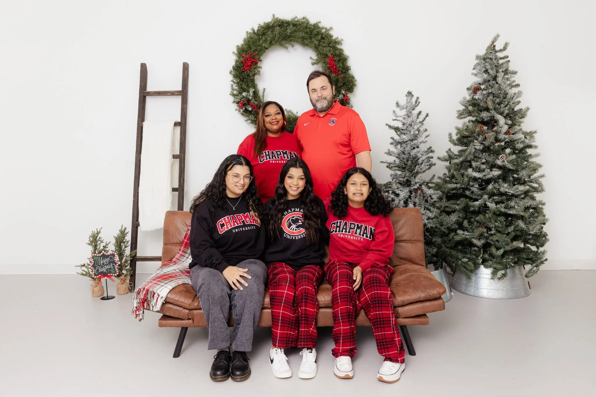 christmas mini sessions tree wreath couch matching pajamas