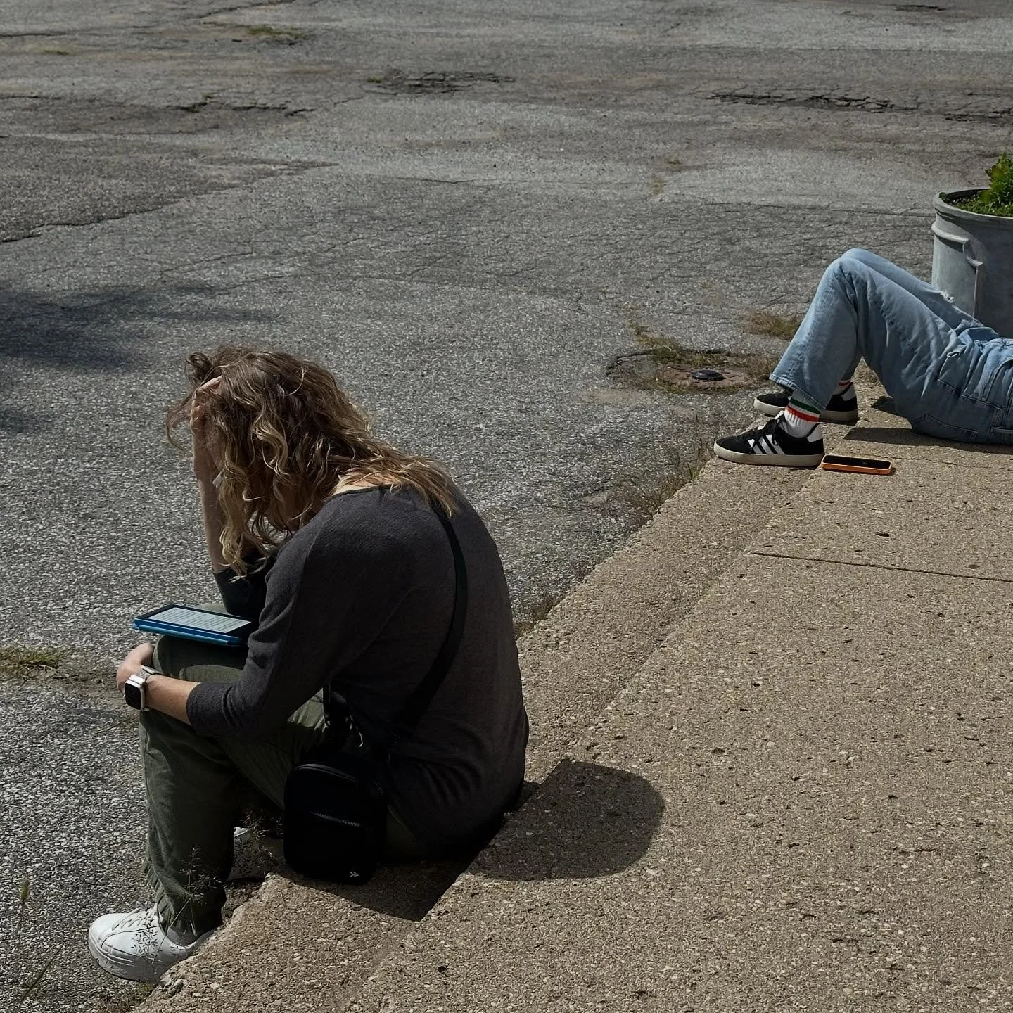 This is me reading while my friends shop. Never leave home without a book! Or you can nap on the sunny sidewalk, as my friend is doing in the upper right. We are not big shoppers.