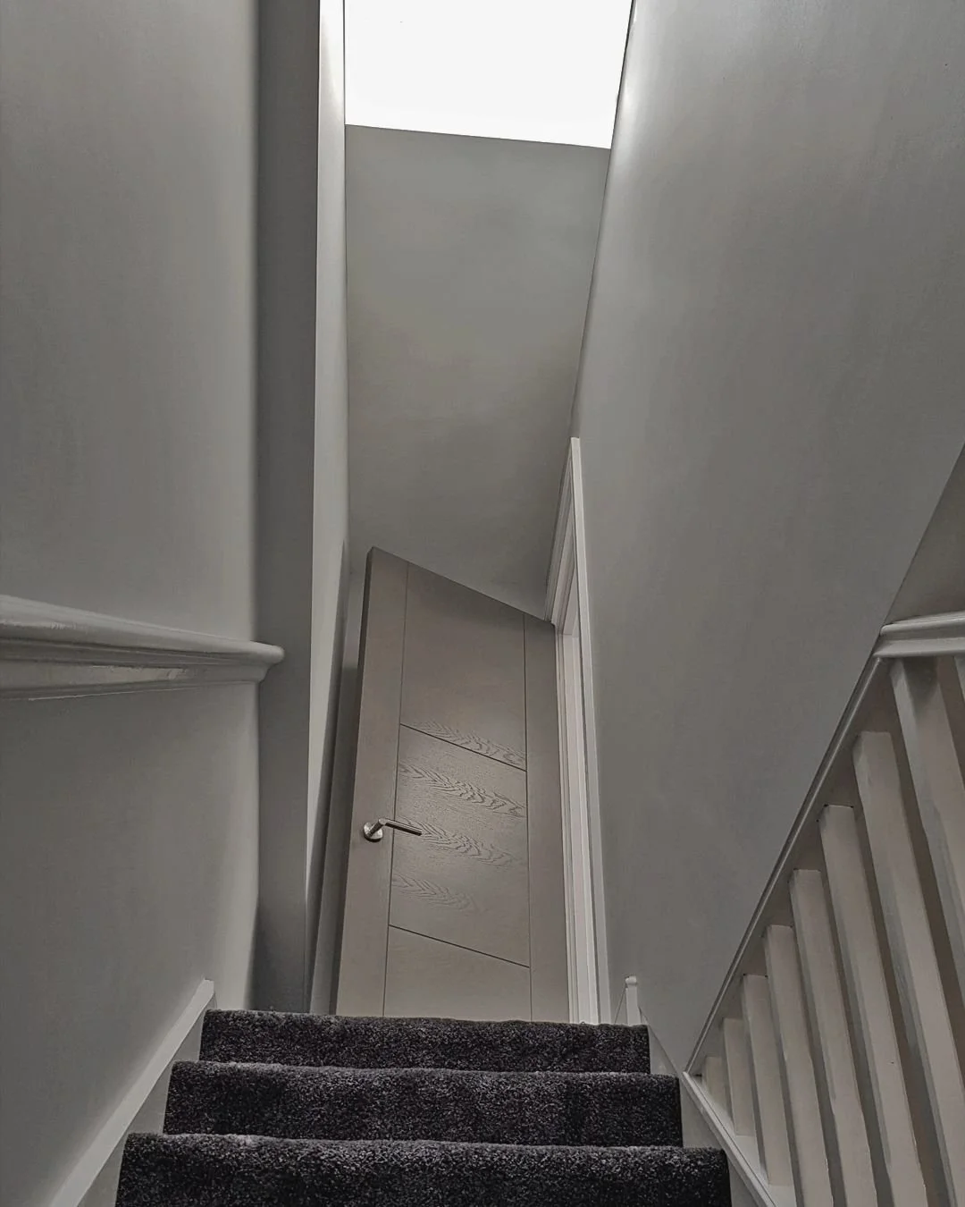 Loft Conversion - London, UK. 2020
.
This loft conversion hosts the master bedroom. An oversized skylight above the staircase provides views of the sky and serves natural light to the lower levels. A deep pile carpet together with a sound insulating