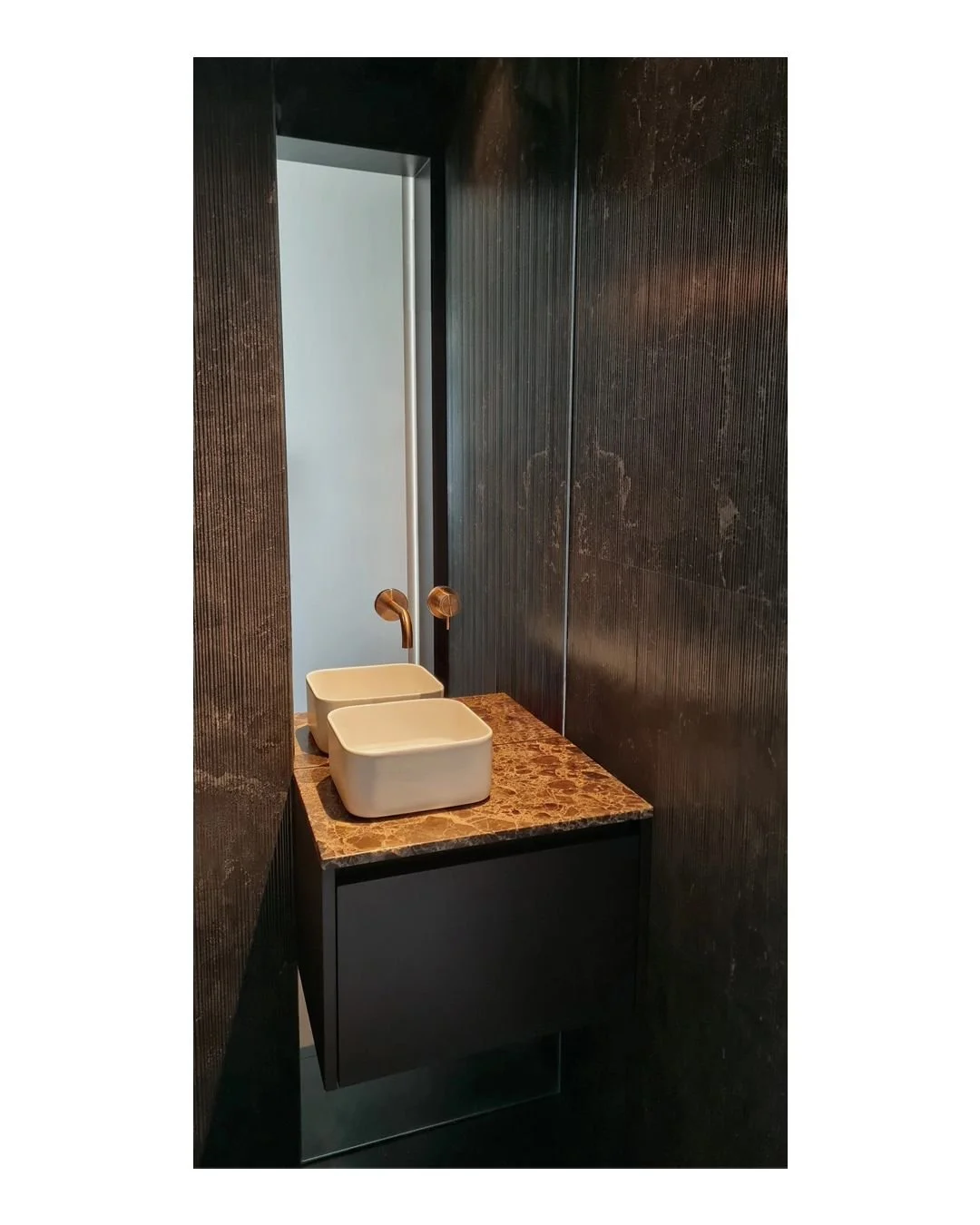 The Reception WC in our recently completed residential renovation in Barnes, London UK, 2023.
.
Stunning composition by Monica Marozzi.
.
Walls and floor finished in Pietra d'Avola textures bamboo and honed. Wash basin in talco finish. Marron emperad