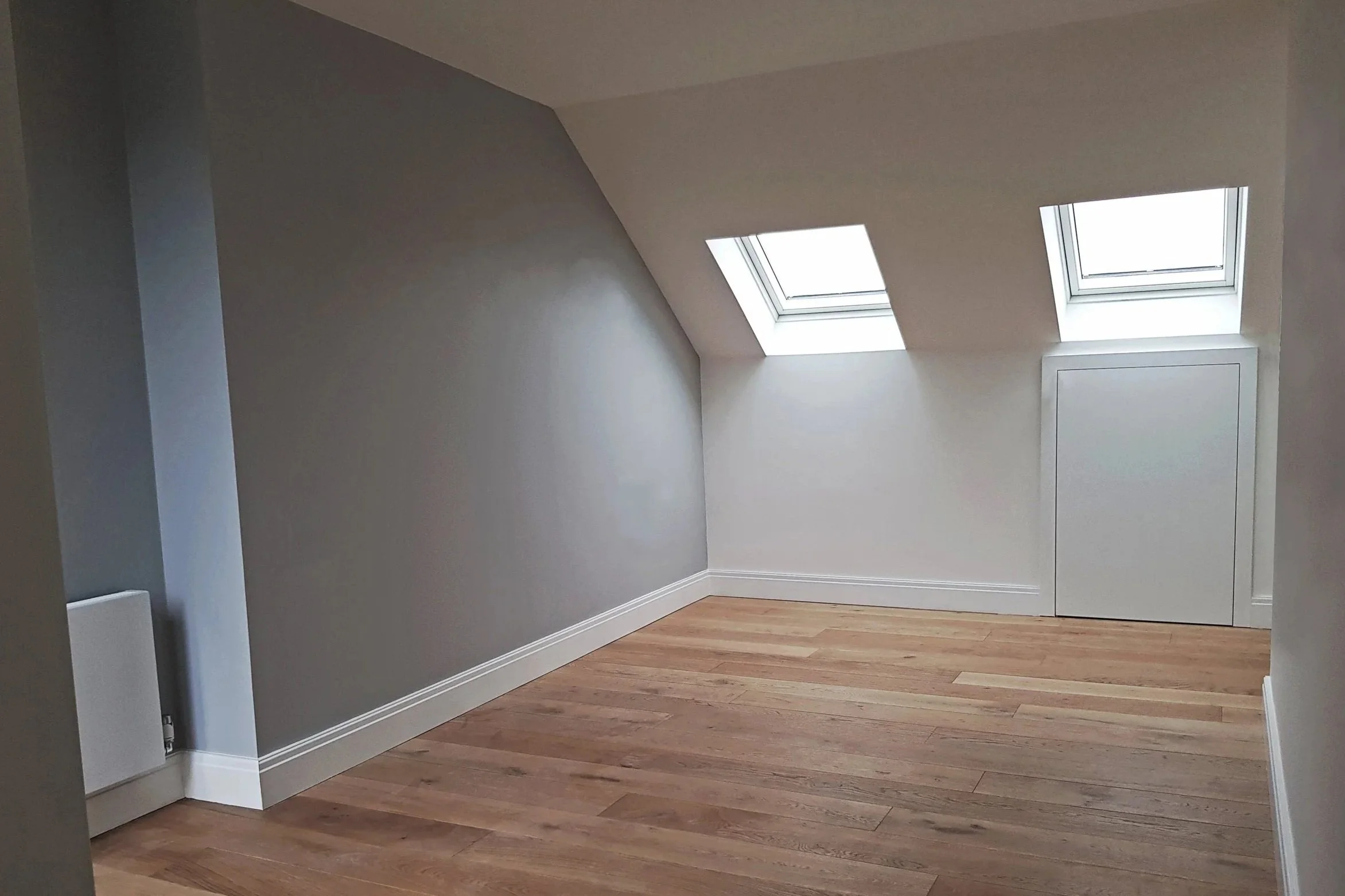 Bright and spacious loft conversion featuring skylights in Ealing, London.